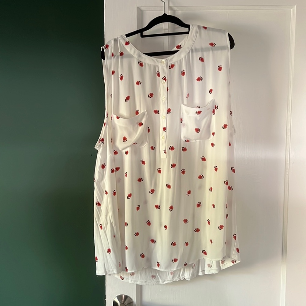 White blouse with red floral detail